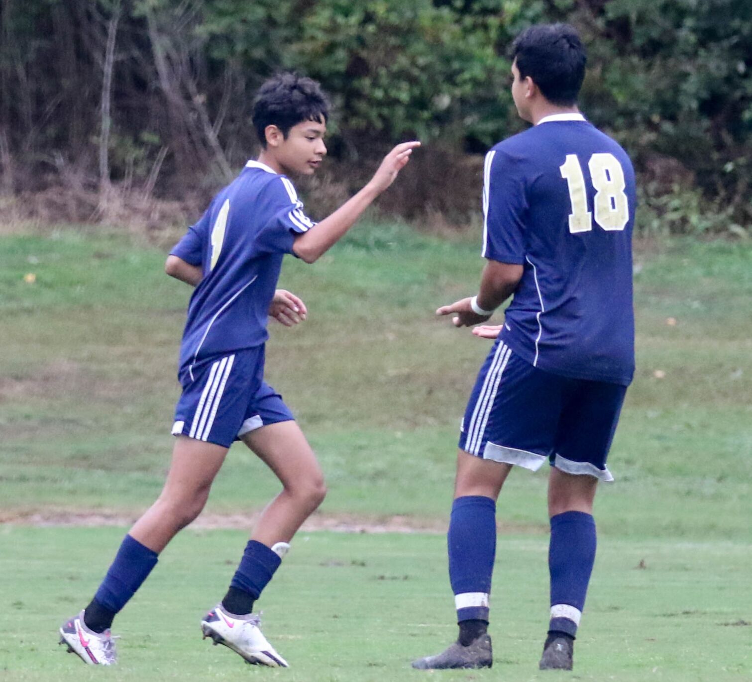 Concord Academy vs Hickory Grove Cuicui Gonzalez (9) is congratulated on his goal by Richy Medina (18). Joan Moore/Special to the Independent Tribune